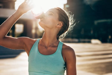 woman drinking a protein shake
