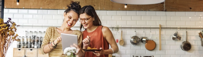 two women in the kitchen planning healthy meals